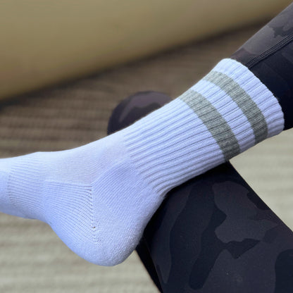 Photo of foot wearing a Skinnys Tubes padded-heel crew sock