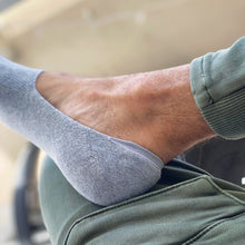 Load image into Gallery viewer, Photo of foot wearing a Skinnys padded-heel sock
